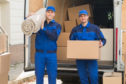 Students moving boxes into local storage in Lee
