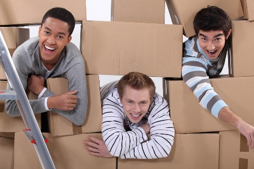 Packed moving boxes ready for a home relocation in Lee