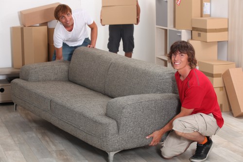 Careful packing of fragile items for house removals in Lee