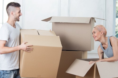 Packed boxes and furniture ready for student storage near Lee