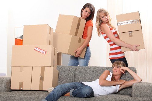 Moving day setup with boxes and household items in Lee